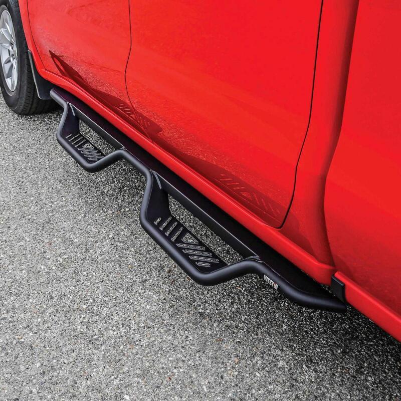 Westin Outlaw Drop Nerf Bars in Tex Black on a Chevy Silverado or GMC Sierra double cab pickup truck.