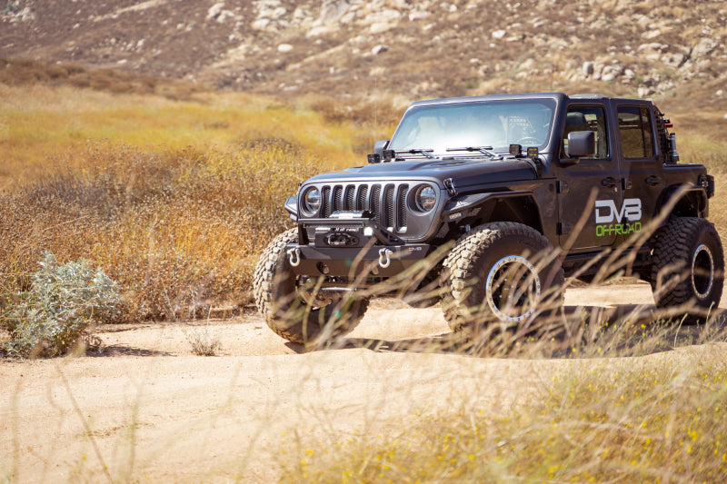 Steel DV8 Offroad FS-25 Stubby Front Bumper with plated bull bar on Jeep Wrangler and Gladiator JT/JK/JL models.