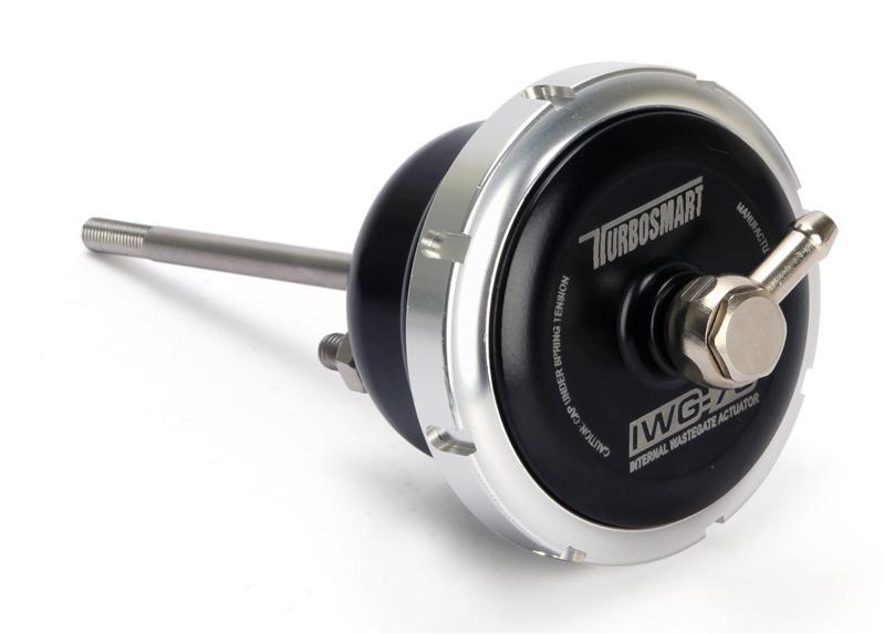 Turbosmart IWG75 black internal wastegate actuator installed on Mitsubishi EVO 10, showing its compact design and mounting details.