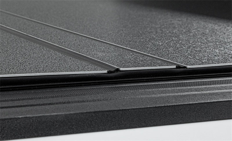 Access LOMAX tri-fold truck bed cover in matte black on a 2020+ Chevy/GMC full-size 2500/3500 with 6ft 8in standard bed.