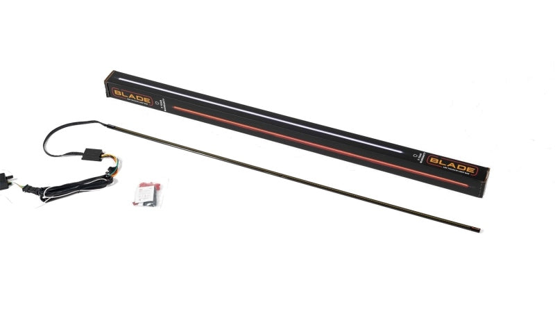 Putco 17-19 Ford Super Duty 60-inch Amber Blade LED Light Bar mounted on truck tailgate with quick-connect harness