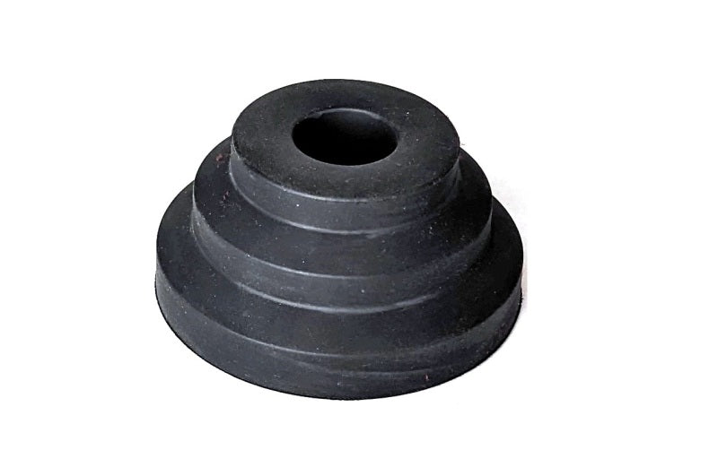 Ridetech rubber bump stop, 1.25 inch tall and 2.5 inch diameter, shown in close-up view on a vehicle suspension component.
