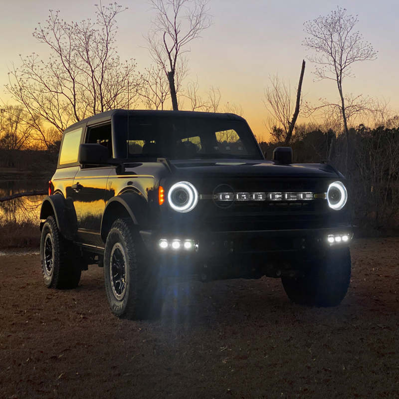 ORACLE Lighting Ford Bronco 21-22 triple LED fog lights installed on steel bumper, showcasing bright white illumination.
