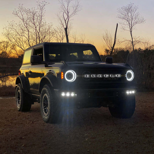 ORACLE Lighting Ford Bronco 21-22 triple LED fog lights installed on steel bumper, showcasing bright white illumination.