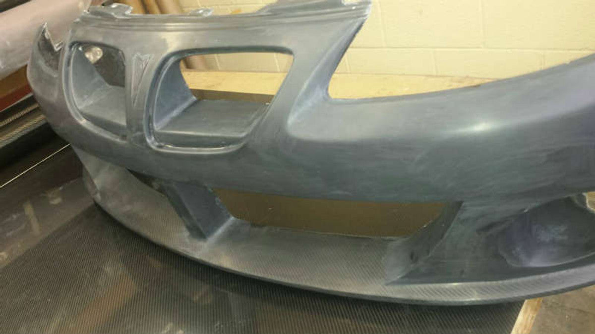 VH649FBC - Advan GM Concepts Design 2004-2007 Pontiac GTO Front Bumper with integrated Carbon Bottom (CFRP/ FRP)