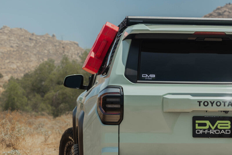 DV8 Offroad Toyota 4Runner exterior window Molle for DV8 roof rack driver side in black metal, part of the vehicle's exterior trim.