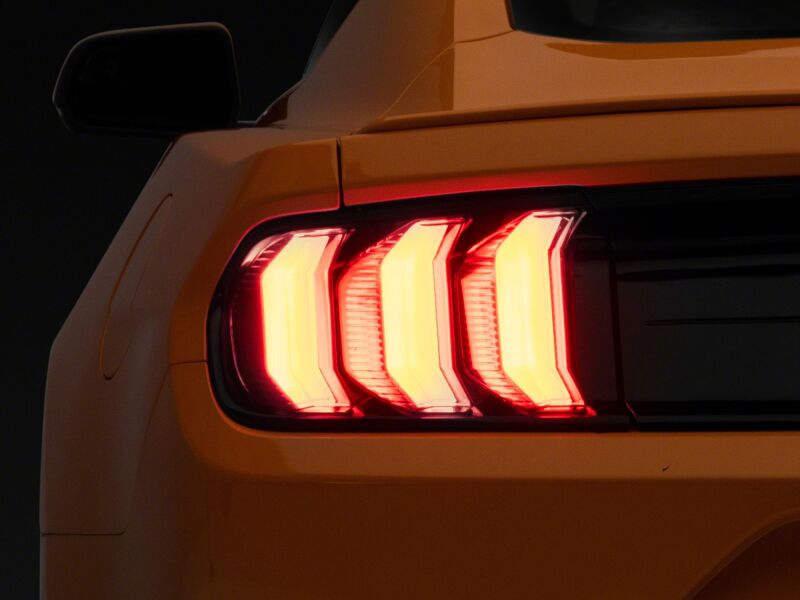 Raxiom Ford Mustang Euro style LED tail lights with gloss black housing and red lens for 2015-2023 model.