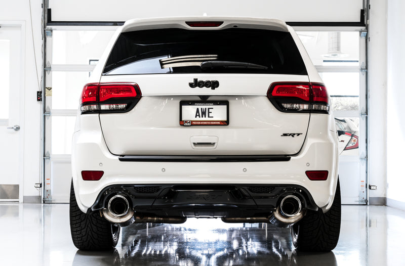 AWE Tuning catback exhaust system with diamond black tips installed on a 2020 Jeep Grand Cherokee SRT, showcasing sleek black exhaust tips.