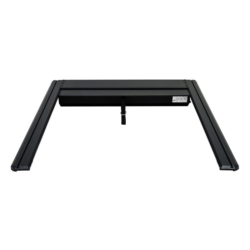 Westin 24-26 Toyota Tacoma black roll-up retractable tonneau cover on a truck bed, providing secure weather-resistant coverage.