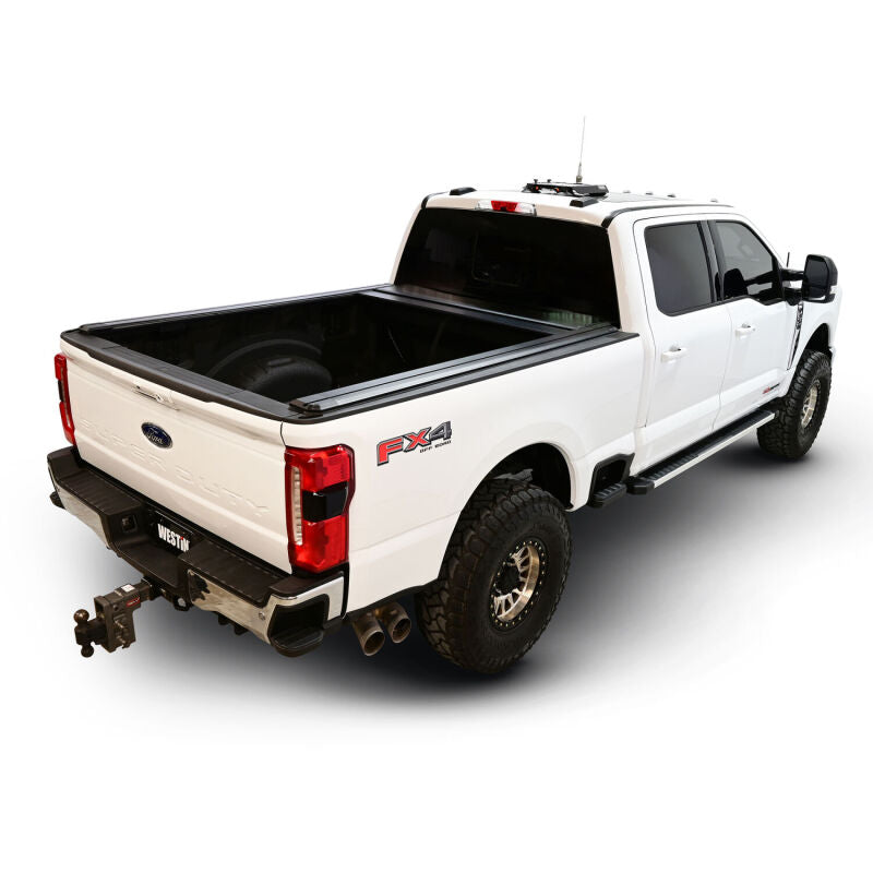 Westin roll-up tonneau cover in black on Ford F-250/F-350/F-450/F-550 SD truck bed, manual retractable design, 6ft 10in length.