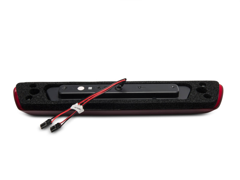 Raxiom LED third brake light for Ford F-150 (09-14), excluding Raptor, with axial series design, mounted on truck tailgate.