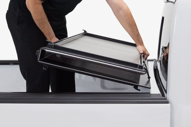Access LOMAX Pro Series tri-fold tonneau cover for 19+ Chevy/GMC 1500 6ft 6in bed in black diamond mist, hard fold design.
