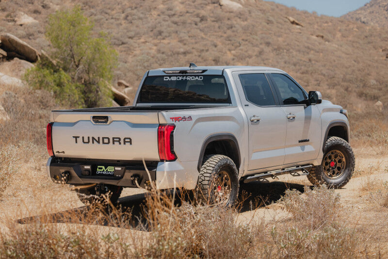 Steel rear bumper for Toyota Tundra DV8 Offroad Spec Series, rugged design with mounting points and reinforced construction.