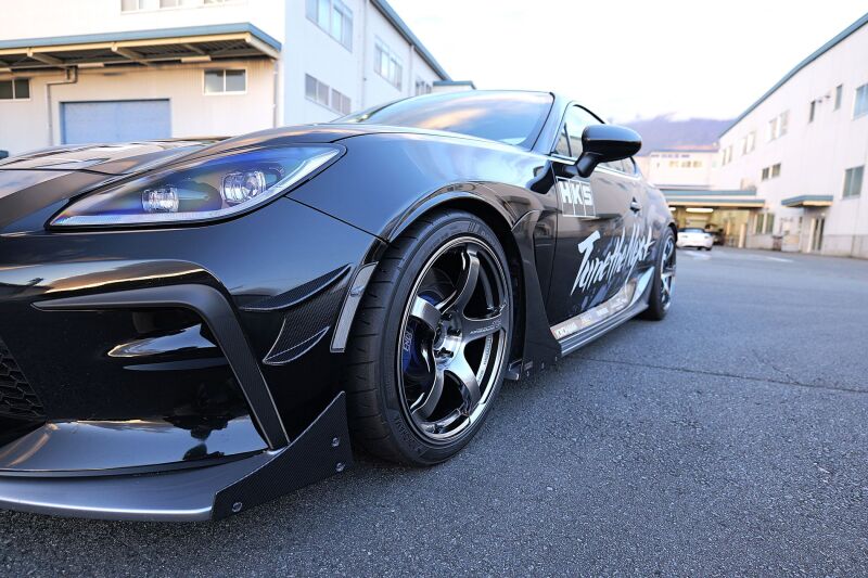 HKS 2022+ Toyota GR86 and Subaru BRZ Fender Molding Kit installed on a sporty coupe's front fender.