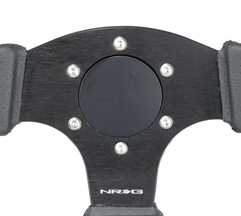 NRG Horn Delete Plate Flush black steering wheel accessory for a clean interior look.