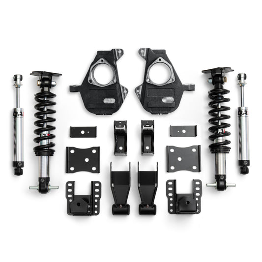 QA1 Chevrolet Silverado 4WD lowering spindles, adjustable from 4 to 6 inches, shown installed on a Silverado truck.