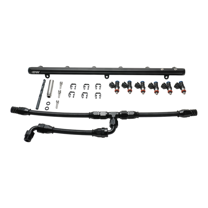 DeatschWerks fuel rail for BMW M2 M3 M4 X3M with plumbing and 1000cc injectors, installed on S58 factory manifold.