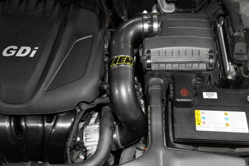 AEM Induction chrome cold air intake for 2006-2009 Honda Civic Si, showing the sleek metal tube and filter attachment.