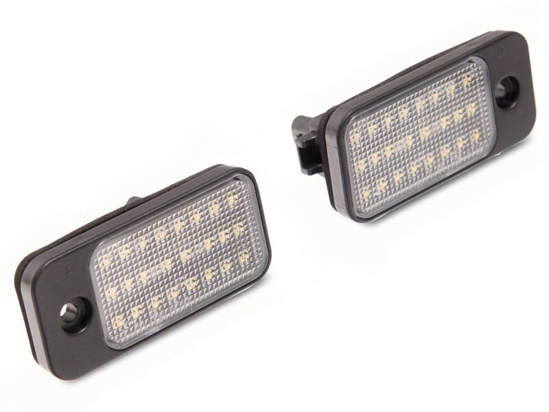 Raxiom LED license plate bulbs for Jeep Cherokee KL 2019-2023, axial series, installed on vehicle with illuminated license plate.