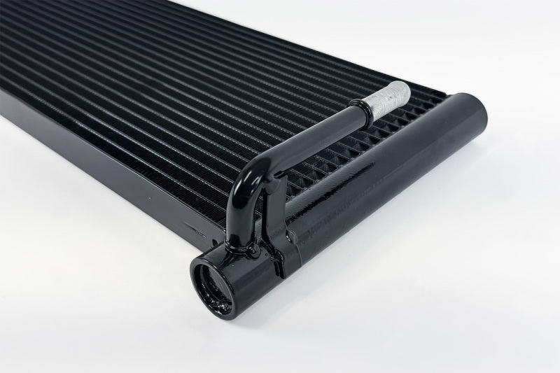 CSF transmission oil cooler for Ford F-150 and Raptor 2009-2014, showing the cooling fins and fittings.