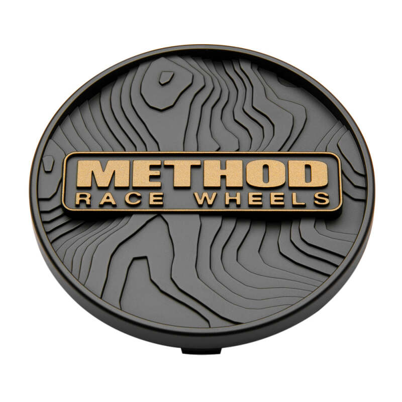 Method Wheels Bronze Topo 107mm snap-in wheel center cap, durable automotive wheel accessory with a sleek finish.