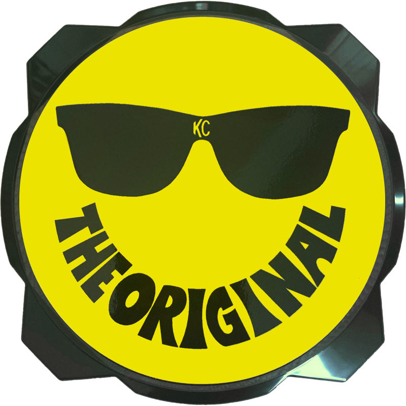 Yellow and black KC HiLiTES 6-inch hard cover with smiley face design for Gravity Pro6 LED lights, featuring KC logo and protective guard.