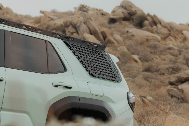 DV8 Offroad exterior window Molle for Toyota 4Runner roof rack, driver side, rugged black trim accessory for added storage.