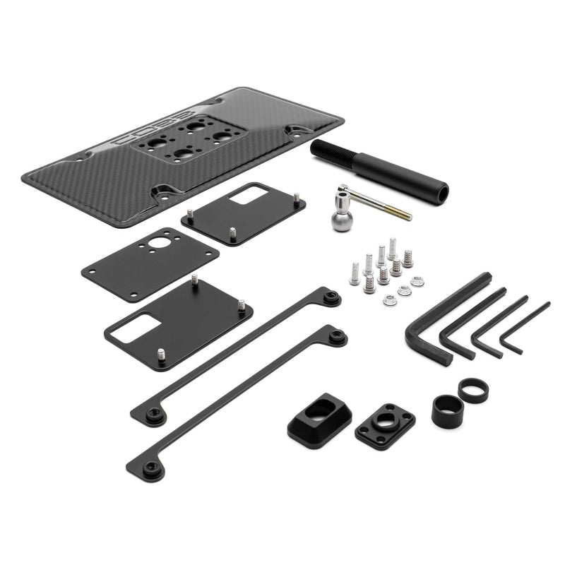 COBB carbon fiber license plate relocation mount for Subaru WRX, Toyota 86, and BRZ models, red finish, high-performance automotive accessory.
