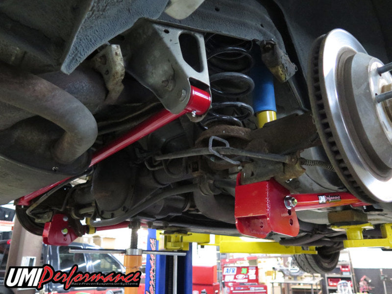 UMI Performance GM F-Body tubular non-adjustable panhard bar showing its sturdy steel construction and mounting points.