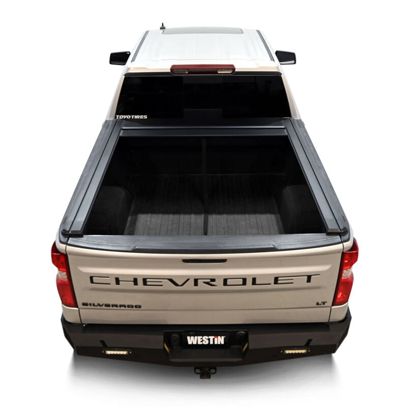Westin roll-up tonneau cover in black on Silverado/Sierra 1500 5ft 8in bed, manual retractable design, protects truck bed.