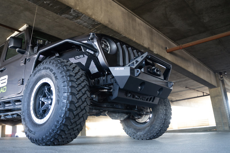 DV8 Offroad Jeep Wrangler JL/JT front bumper sway-bar disconnect motor skid plate, rugged off-road protection for Jeep vehicles.