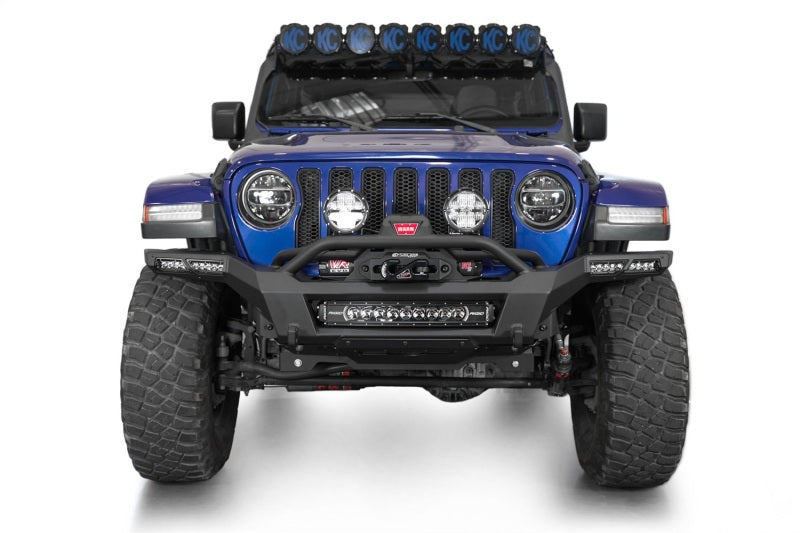 Addictive Desert Designs steel rear bumper for Jeep Wrangler JL and Gladiator JT with built-in winch mount and rugged black finish.