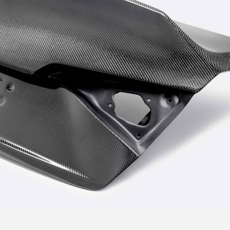 Seibon carbon fiber trunk lid for 2022-2023 Honda Civic 4-door C-Style, showing sleek textured surface and aerodynamic design.