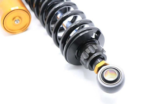 Ohlins blackline shock absorber with gold accents for Harley-Davidson Dyna FXD 91-17, showing polished metal and mounting components.
