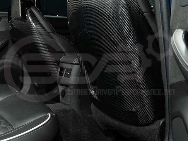 Pair of black carbon fiber seat back panels for Cadillac CT5-V and CT5-V Blackwing interior trim, driver and passenger side.