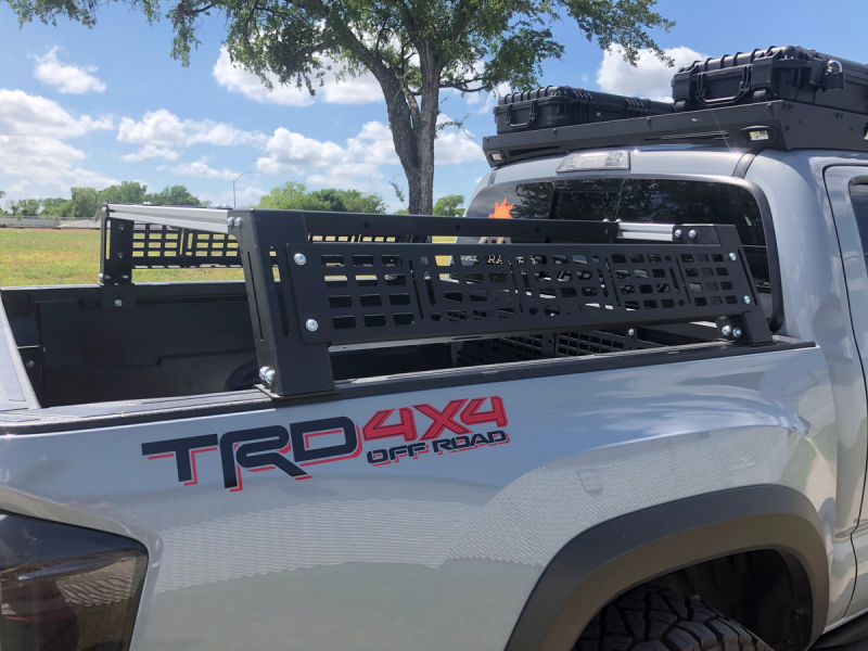 Cali Raised LED Toyota Tacoma overland bed rack for short bed trucks, low profile design, durable metal construction, installed on truck bed