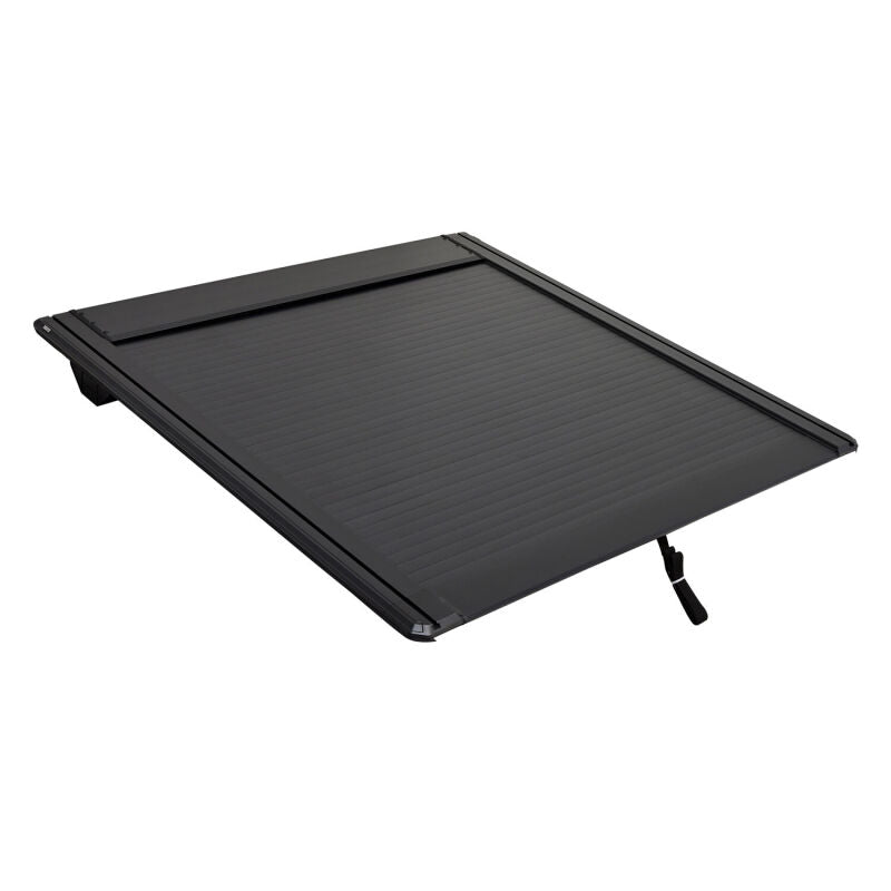 Westin manual retractable roll-up tonneau cover on black Toyota Tundra 5.5ft bed, showing its sleek design and secure fit.