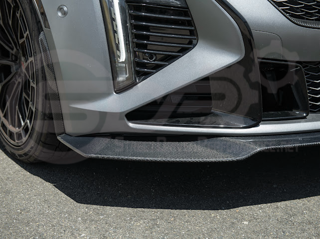Factory OEM style carbon fiber front lip splitter and wheel arches for Cadillac CT5-V Blackwing, sleek and aerodynamic ground effects.