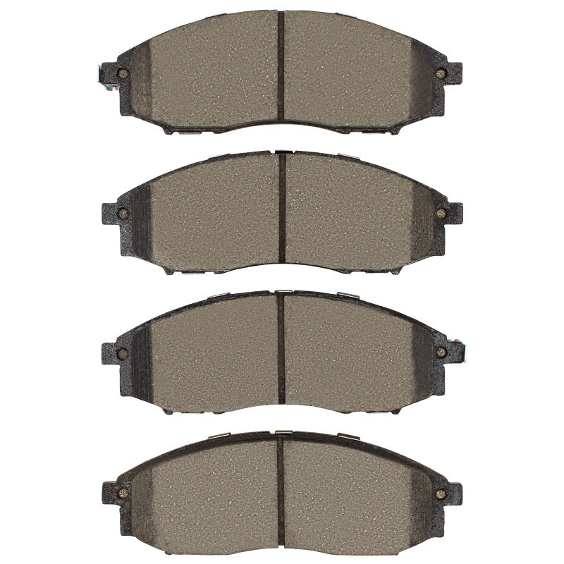 R1 Concepts Nissan XTerra front ceramic brake pads, OE type, showing smooth brake pad surface and packaging.