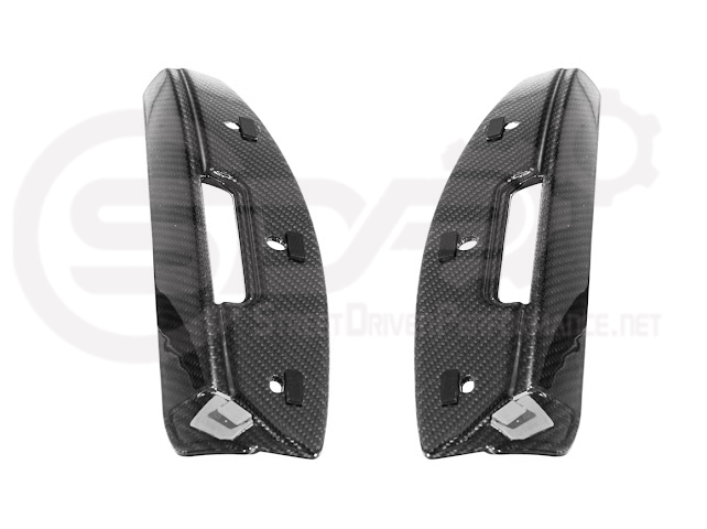 Cadillac CT5-V Blackwing factory OEM style carbon fiber front lip splitter and wheel arches on a sleek sedan.