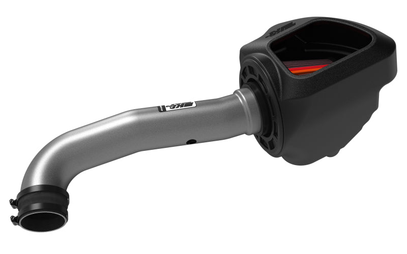 K&N Engineering aluminum cold air intake system installed in a 2012-2018 Jeep Wrangler NextGen, showing the intake tube and filter.
