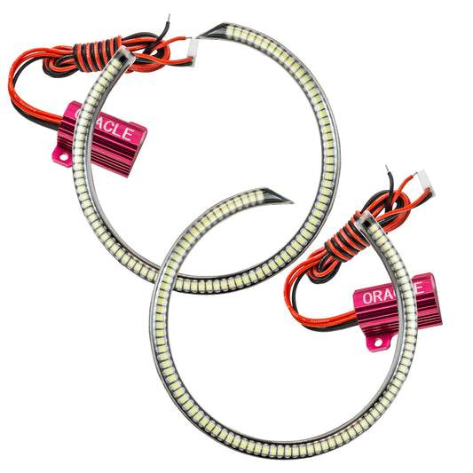 Oracle Lighting Ford Mustang 2010-2013 grille-style WP LED fog halo kit in white, showing the halo rings installed around fog lights.