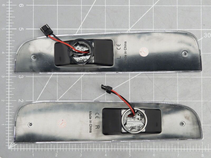 Raxiom LED side marker lights for Jeep Cherokee XJ 97-01, clear lens, mounted on vehicle side for improved visibility.