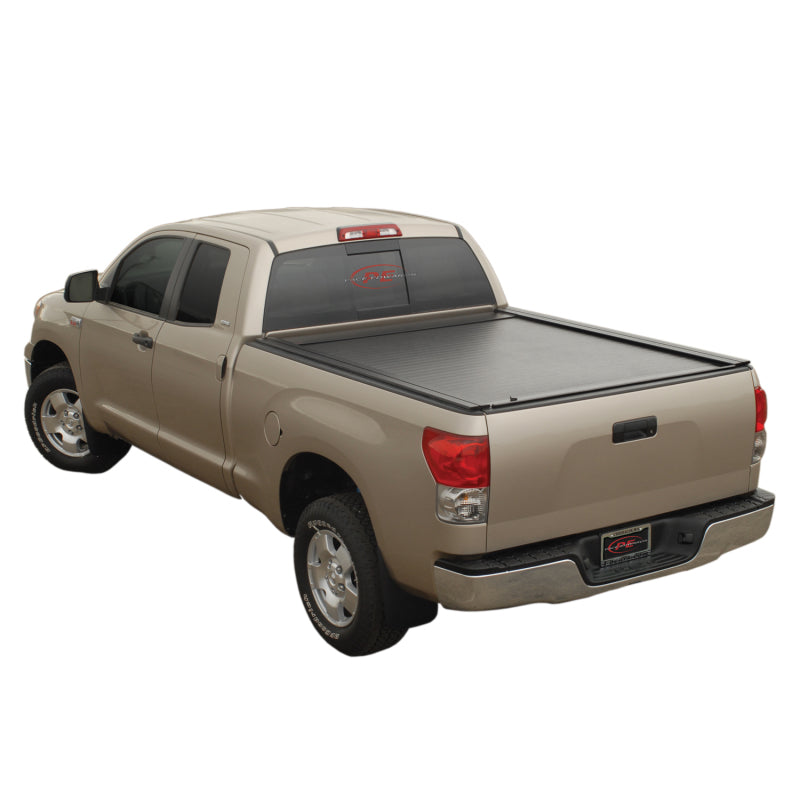 Pace Edwards JackRabbit retractable metal bed cover on Toyota Tundra Dbl Cab 6ft 2in with Explorer Rails in a truck bed.
