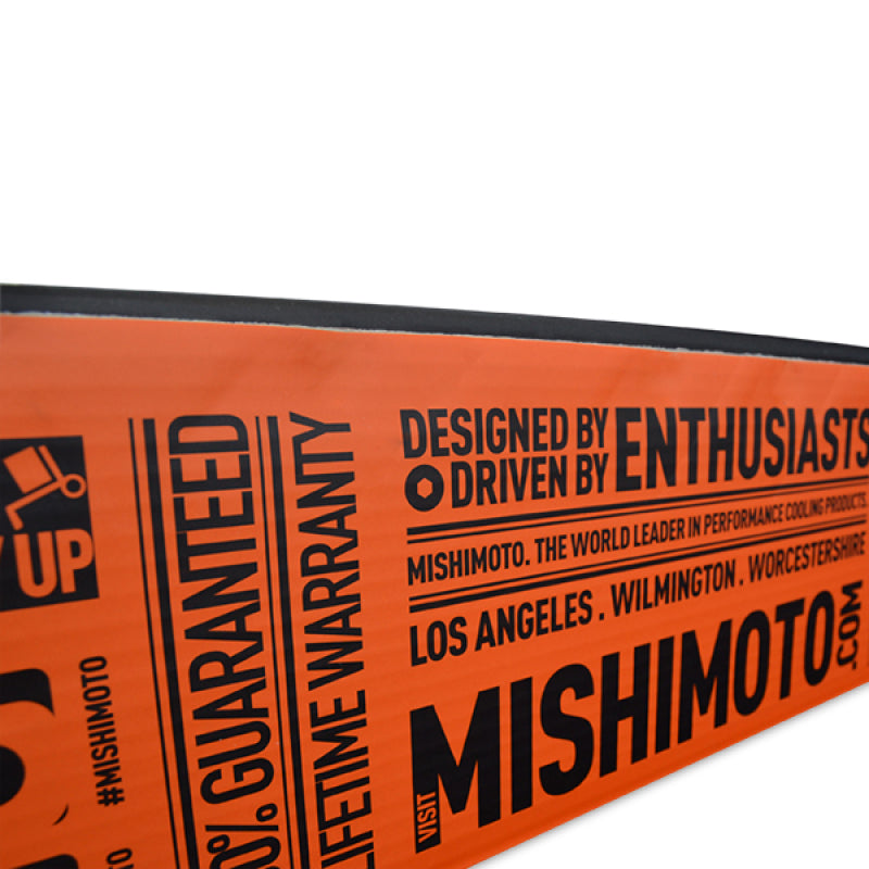 Mishimoto aluminum radiator for 1991-1999 Mitsubishi 3000GT Turbo, with cooling fins and inlet/outlet hoses visible.