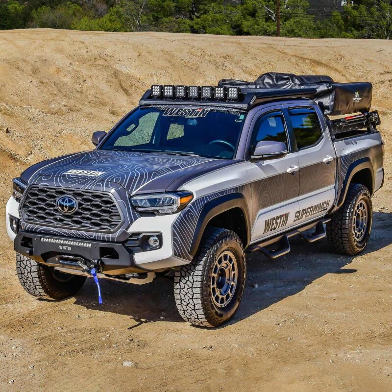 Westin Toyota Tacoma Mesa roof rack installed on a 16-23 model, durable black metal roof rack for cargo and accessories.