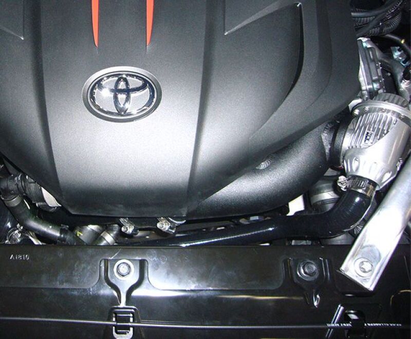 HKS Super SQV IV Suction Return Kit installed on a Toyota GR Supra OEM intake, featuring a black blow-off valve and related components.