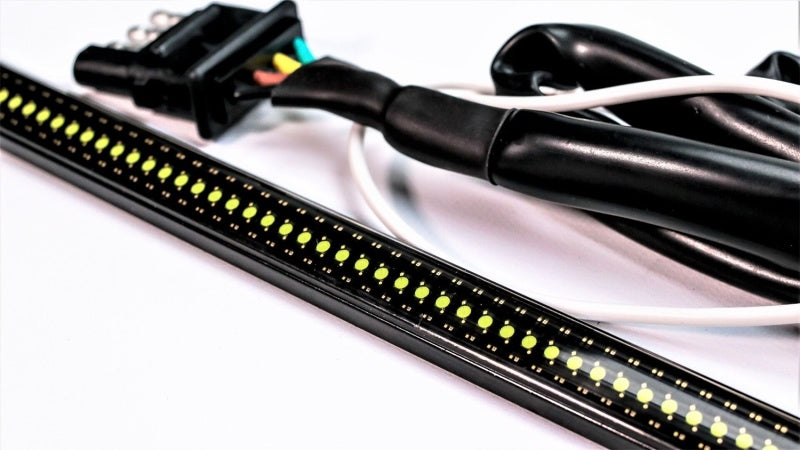 Putco 17-19 Ford Super Duty 60-inch Amber Blade LED light bar on tailgate with quick-connect harness, durable truck lighting accessory.