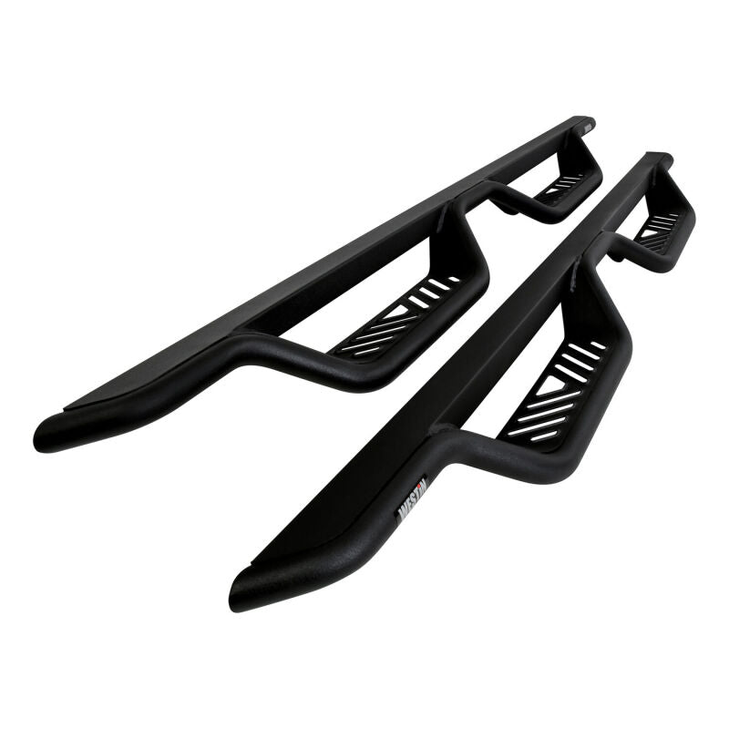 Westin Outlaw Drop Nerf Bars in Tex Black installed on a Chevy Silverado or GMC Sierra double cab pickup truck.