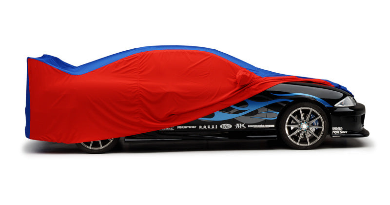 Covercraft WeatherShield HP car cover on a Porsche Taycan, multi-color, providing protection for the vehicle.